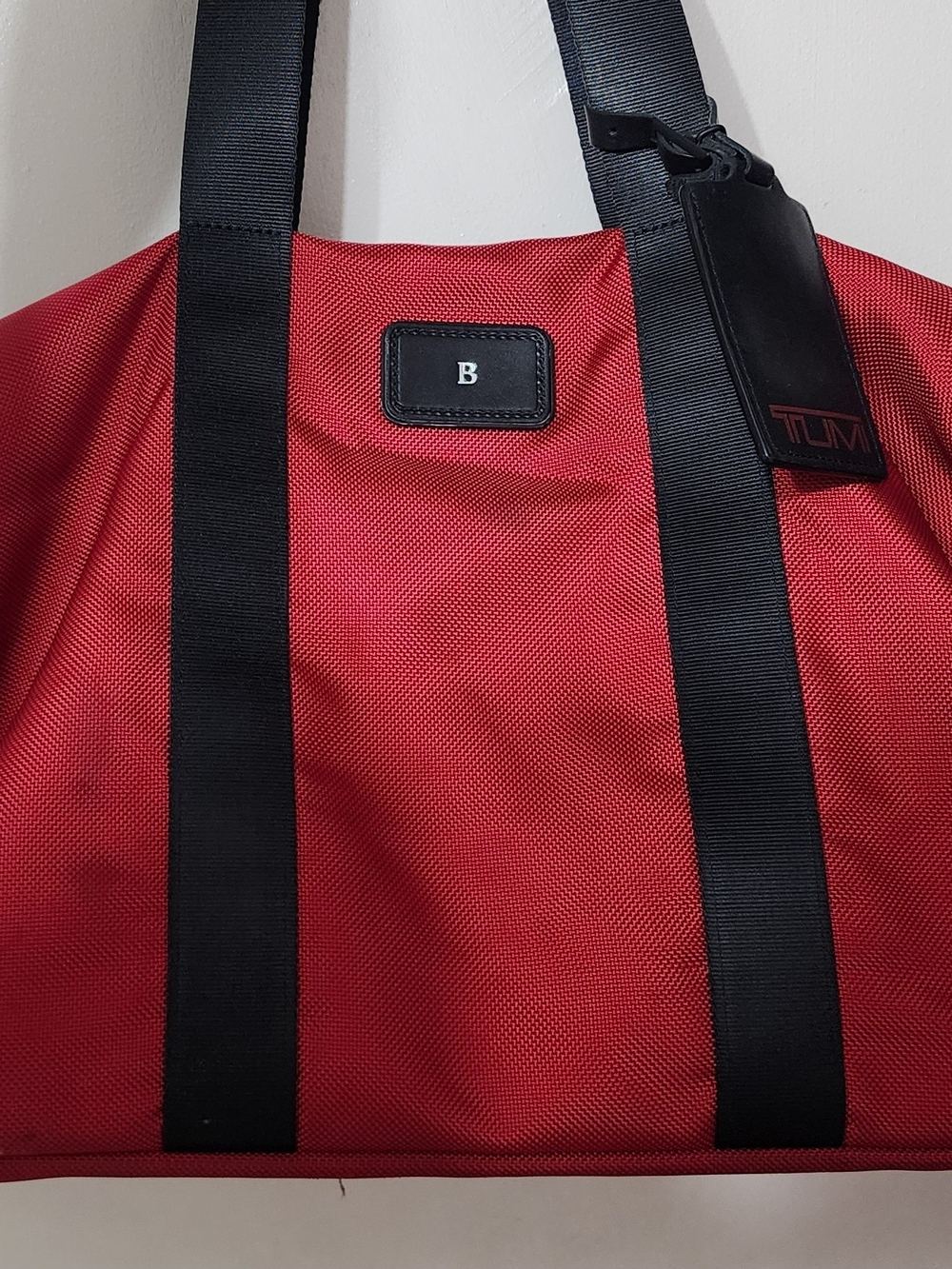 Tumi Red Duffel Tote with Black Straps